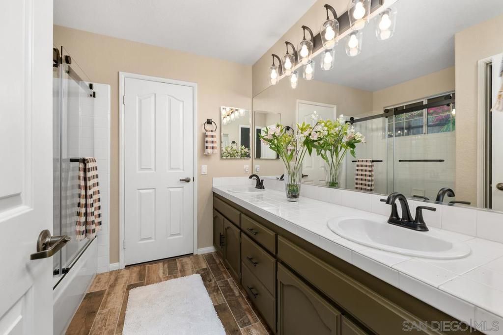 Bathroom, Dual Sink Vanities, Glass Shower, Interior, Tile Countertops, Wood Texture Flooring