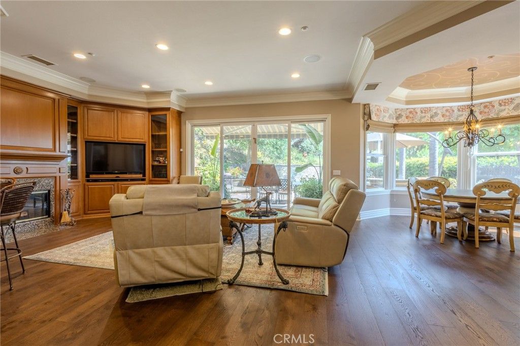 Chandelier, Dining room, Fireplace, Interior, Living room, Recessed Lighting, Wood Texture Flooring