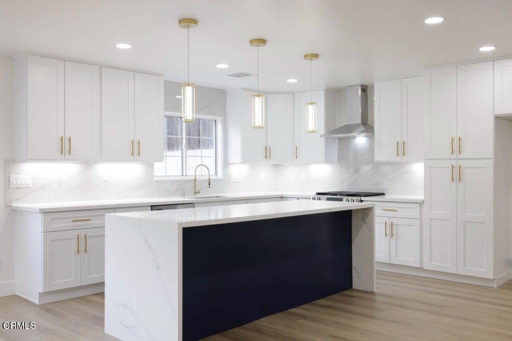 Interior, Kitchen, Marble Walls, Pendant Lights, Recessed Lighting, Stainless Steel Appliances, Wood Texture Flooring