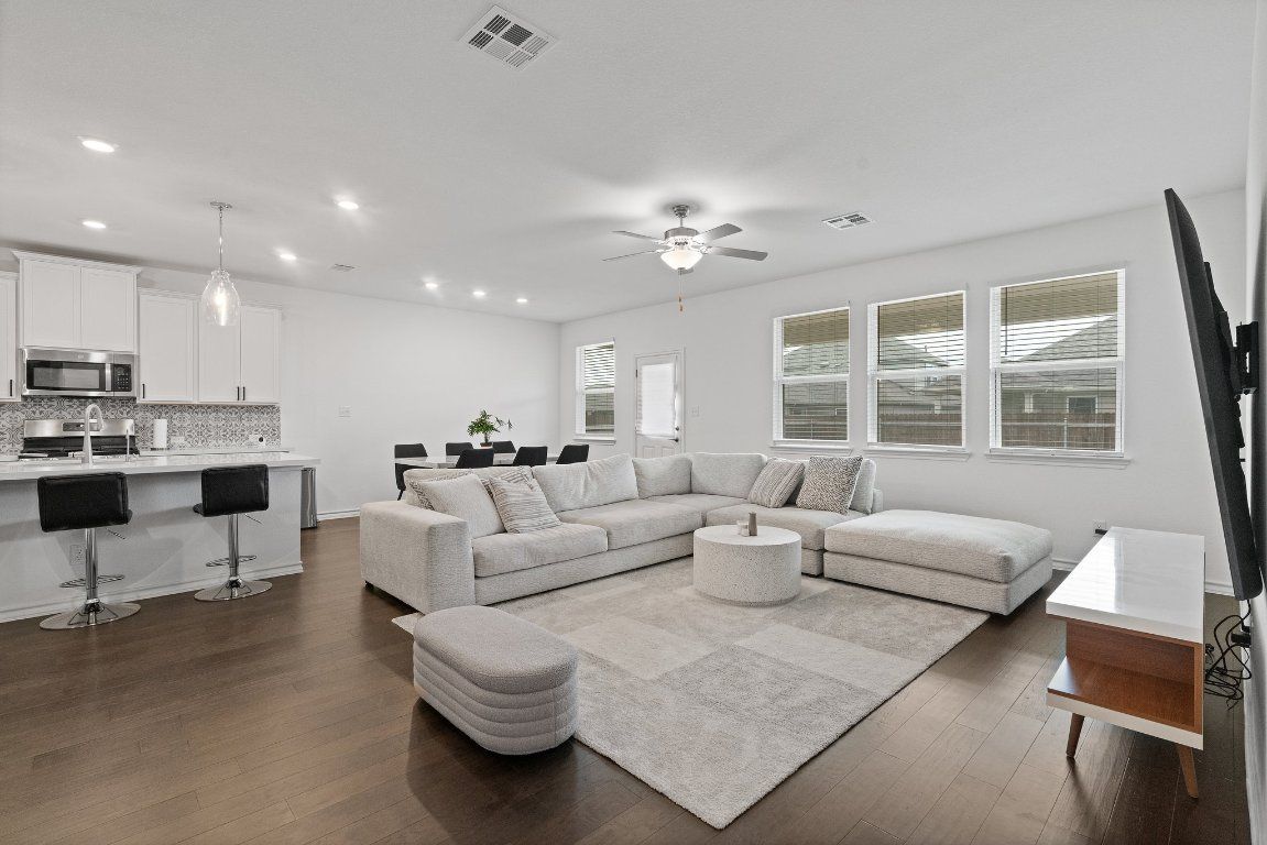 Dining room, Interior, Kitchen, Living room, Pendant Lights, Recessed Lighting, Stainless Steel Appliances, Wood Texture Flooring