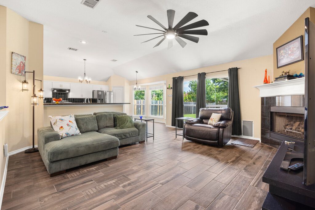 Chandelier, Fireplace, Interior, Kitchen, Living room, Pendant Lights, Recessed Lighting, Wood Texture Flooring