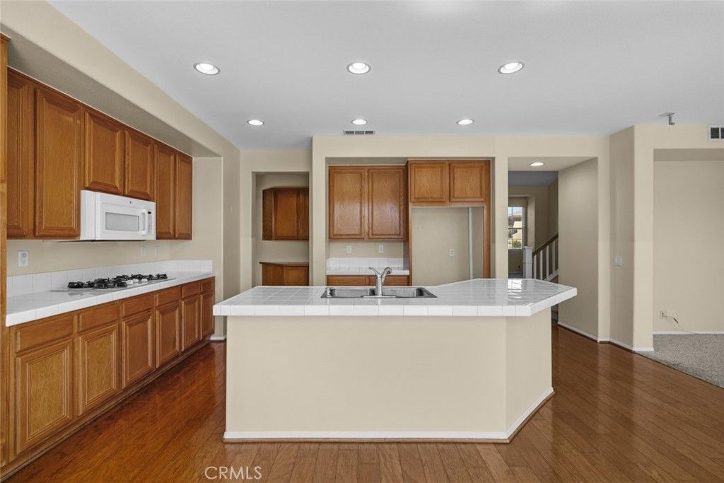 Interior, Kitchen, Recessed Lighting, Tile Countertops, Wood Texture Flooring