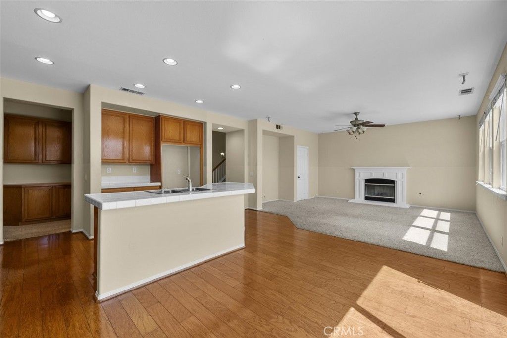 Empty room, Fireplace, Interior, Kitchen, Recessed Lighting, Wood Texture Flooring
