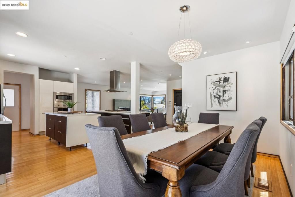Chandelier, Dining room, Interior, Kitchen, Pendant Lights, Recessed Lighting, Stainless Steel Appliances, Wood Texture Flooring