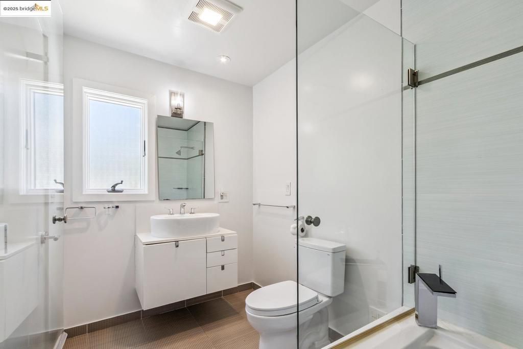 Bathroom, Dual Sink Vanities, Glass Shower, Interior, Recessed Lighting, Wood Texture Flooring