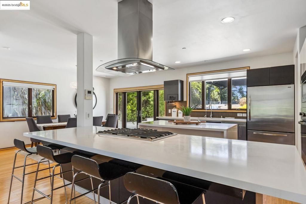 Dining room, Interior, Kitchen, Recessed Lighting, Stainless Steel Appliances, Wood Texture Flooring
