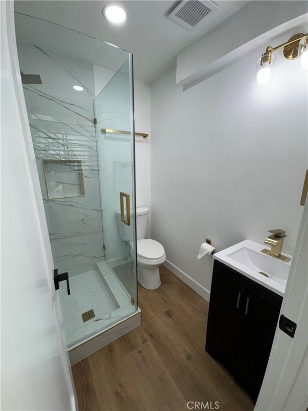 Bathroom, Glass Shower, Interior, Marble Walls, Recessed Lighting, Wood Texture Flooring