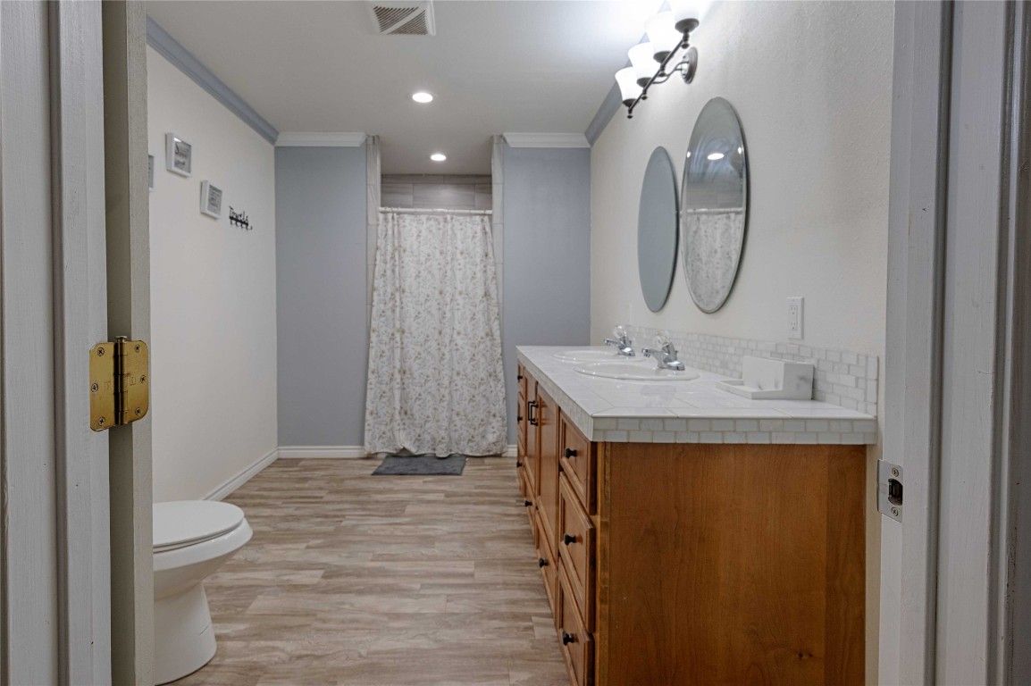 Bathroom, Dual Sink Vanities, Interior, Recessed Lighting, Tile Countertops, Wood Texture Flooring