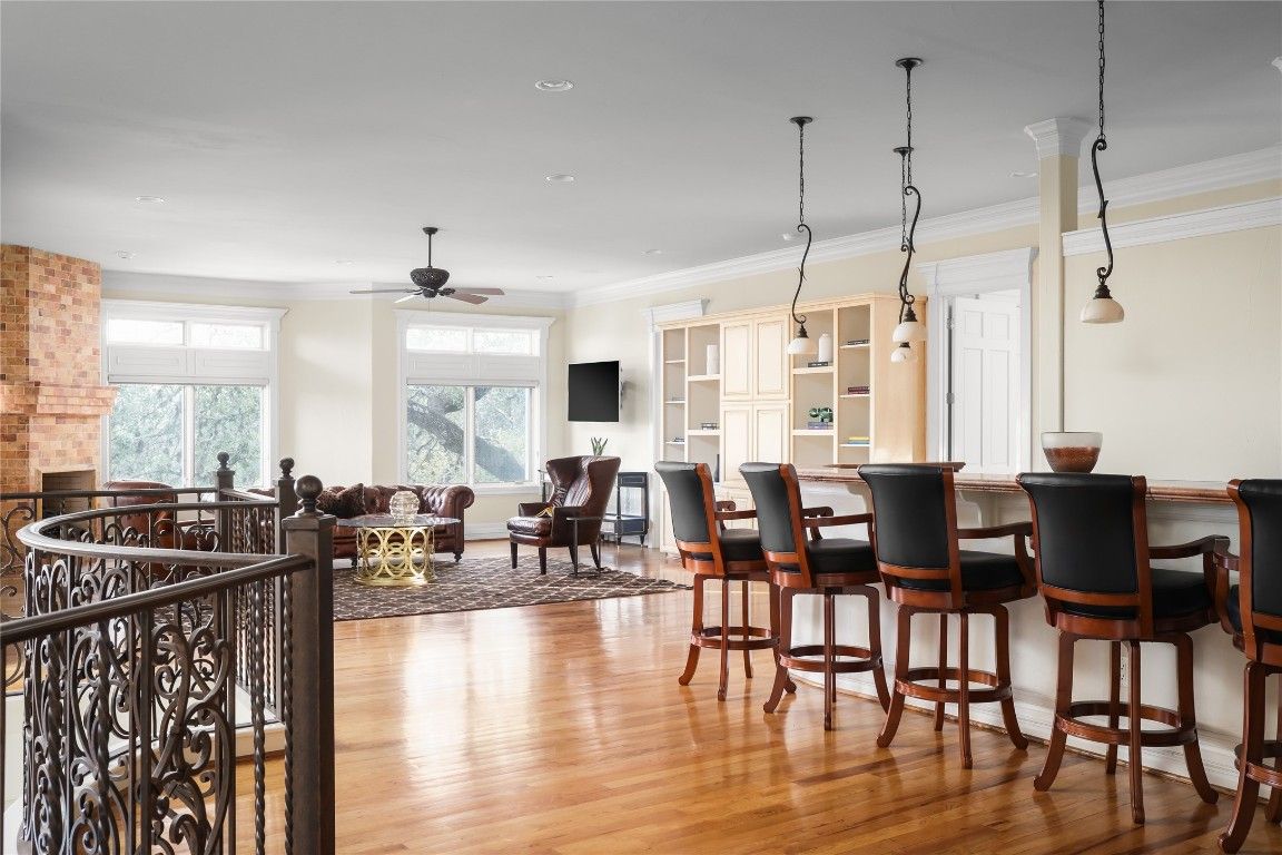 Dining room, Fireplace, Interior, Living room, Pendant Lights, Recessed Lighting, Stone Walls, Wood Texture Flooring