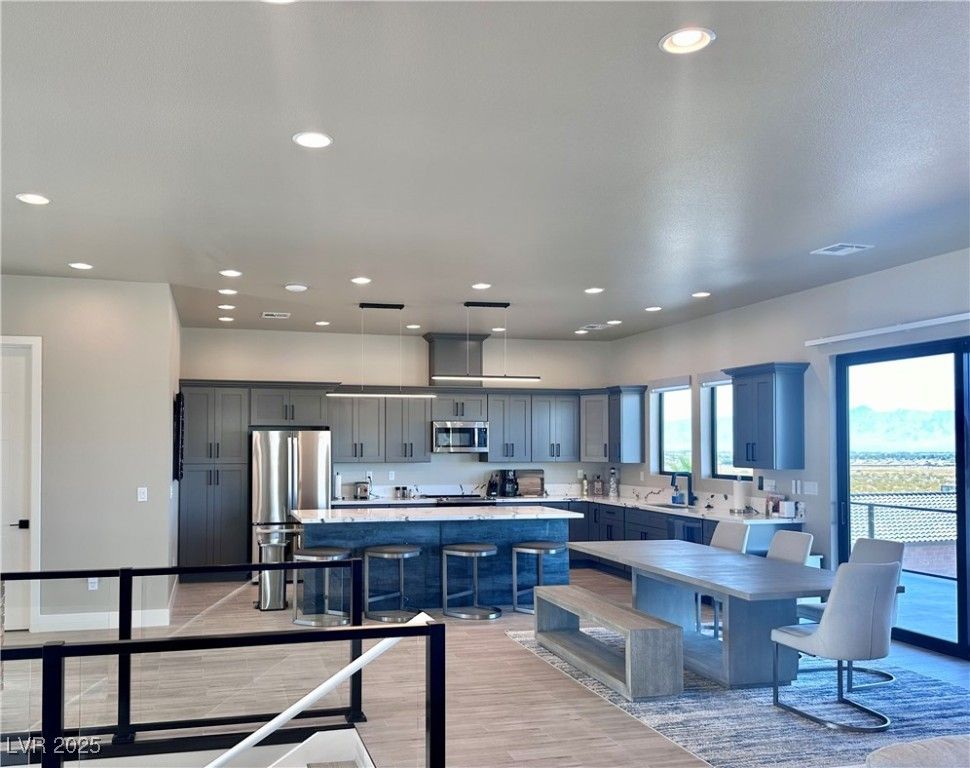 Dining room, Interior, Kitchen, Pendant Lights, Recessed Lighting, Stainless Steel Appliances, Wood Texture Flooring