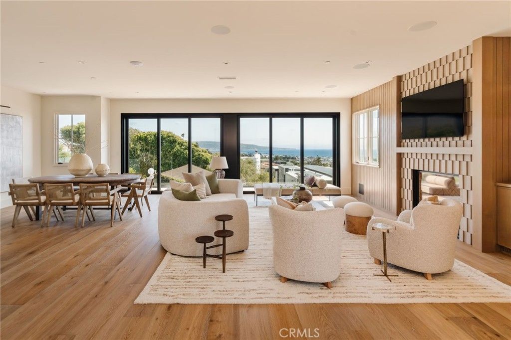 Dining room, Fireplace, Interior, Living room, Recessed Lighting, Water, Wood Texture Flooring