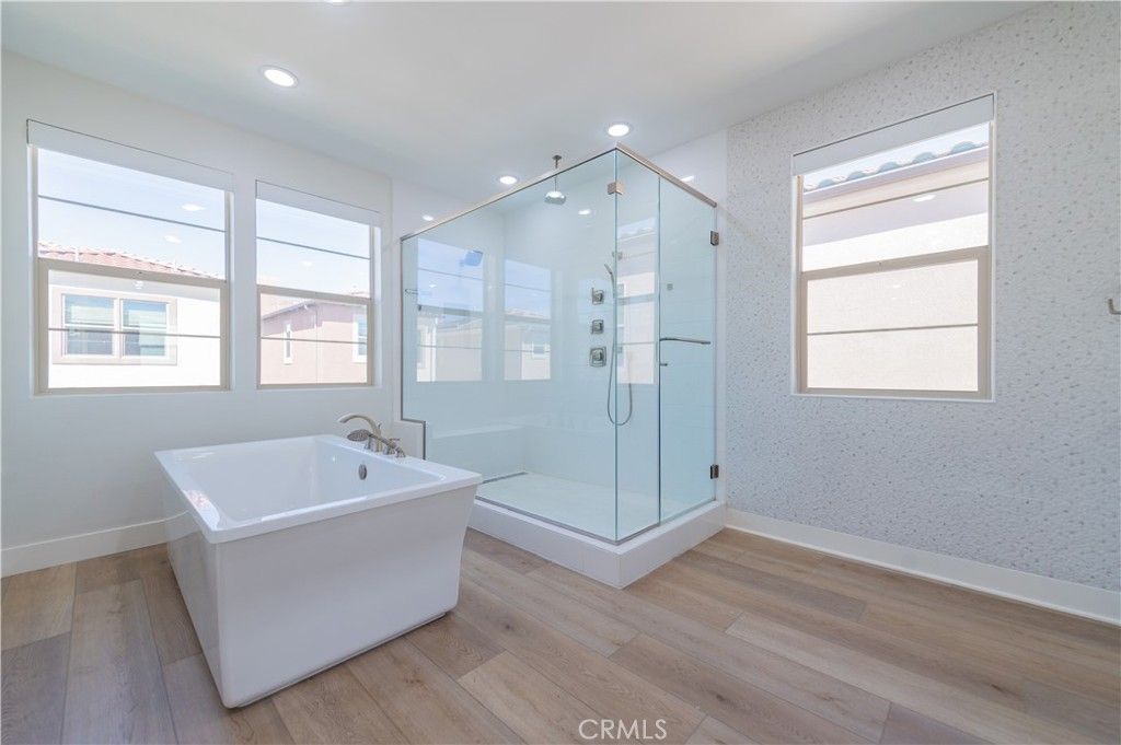 Bathroom, Free Standing Baths, Glass Shower, Interior, Recessed Lighting, Wood Texture Flooring