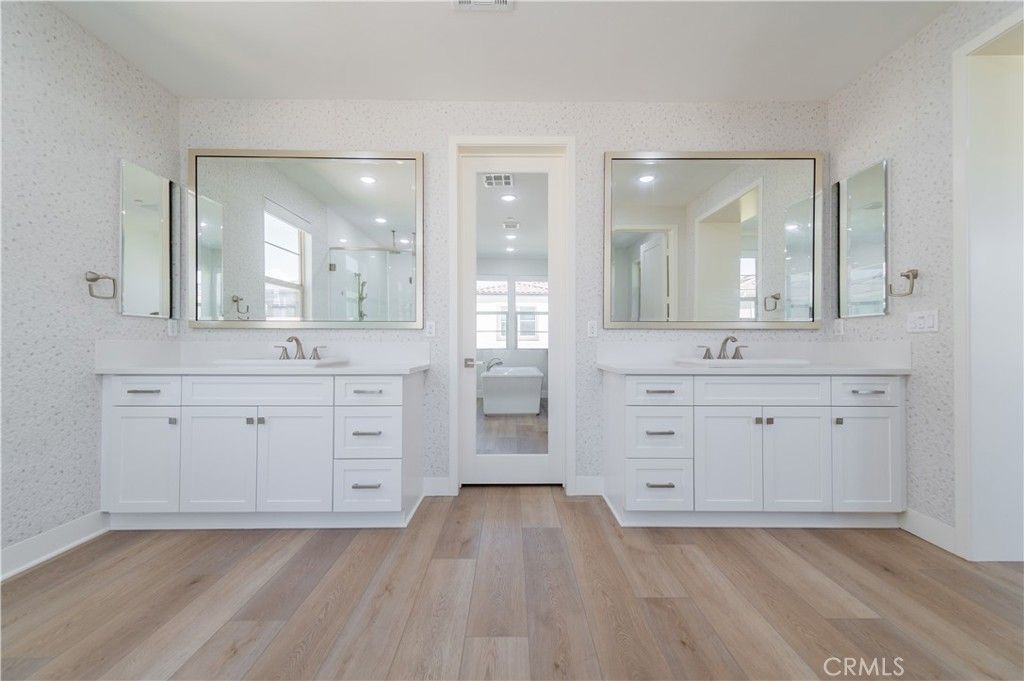 Bathroom, Dual Sink Vanities, Interior, Recessed Lighting, Wood Texture Flooring