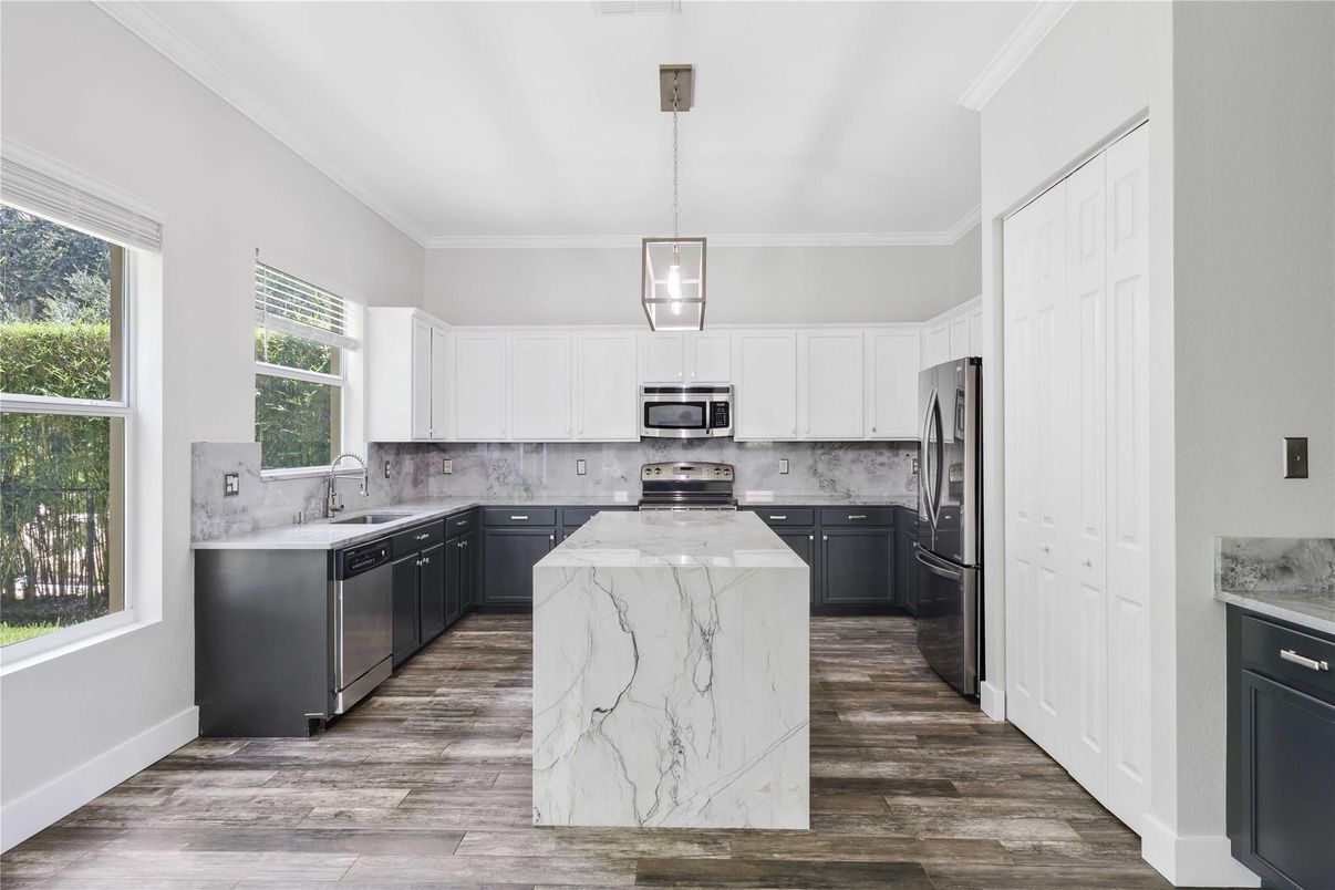 Interior, Kitchen, Marble Walls, Pendant Lights, Stainless Steel Appliances, Wood Texture Flooring