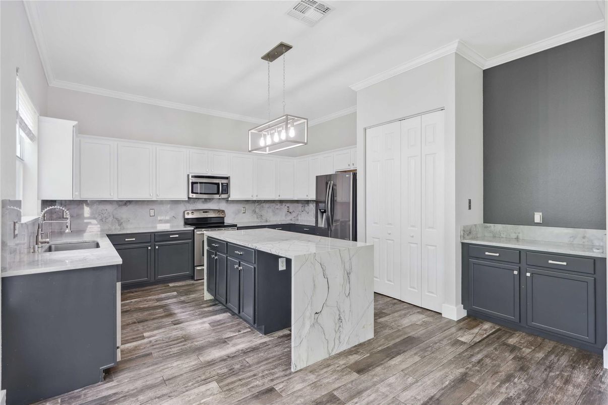 Interior, Kitchen, Marble Walls, Pendant Lights, Stainless Steel Appliances, Wood Texture Flooring