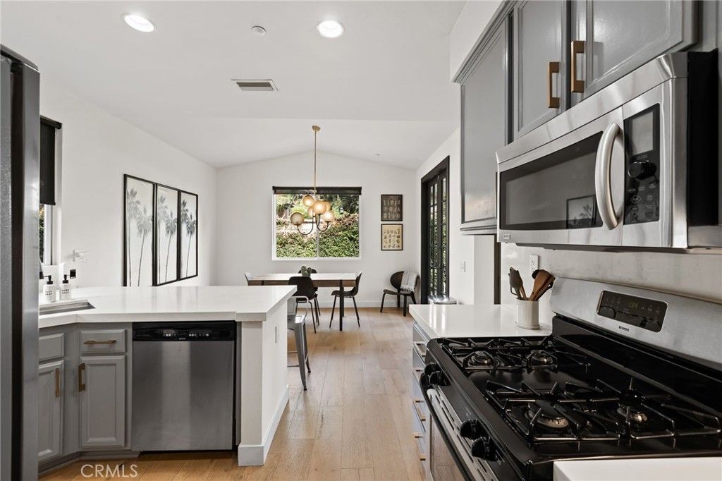 Dining room, Interior, Kitchen, Pendant Lights, Recessed Lighting, Stainless Steel Appliances, Wood Texture Flooring