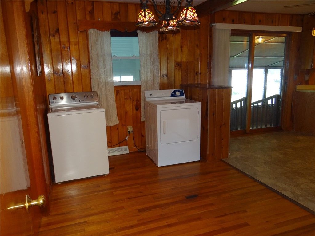 Interior, Utility Closets, Washer, Wood Texture Flooring, Wooden Walls
