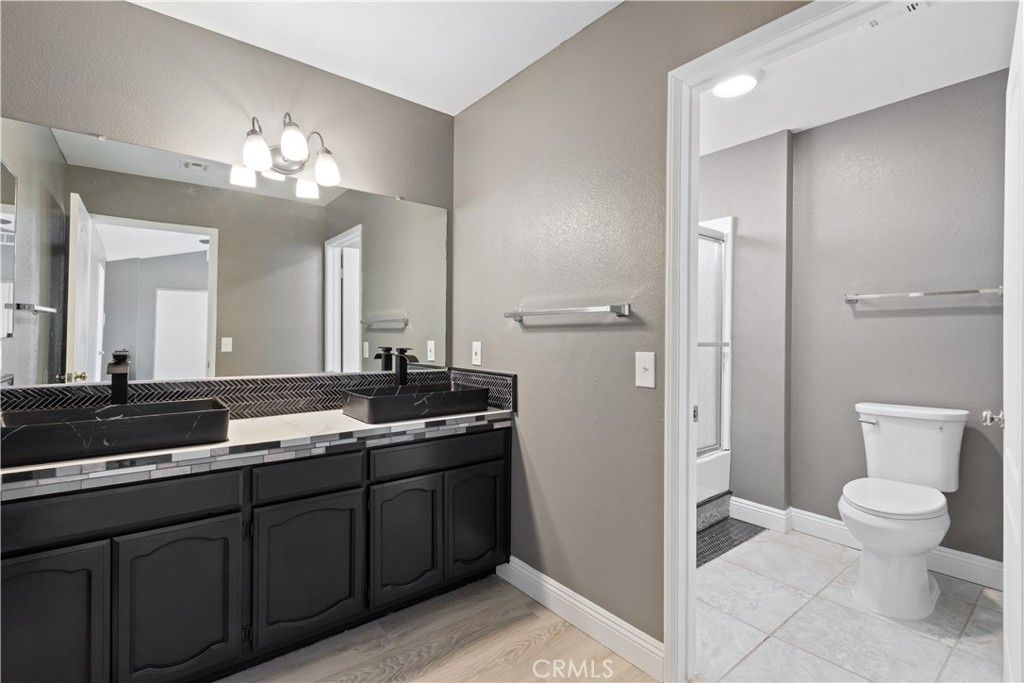 Bathroom, Dual Sink Vanities, Interior, Recessed Lighting, Tile Countertops, Wood Texture Flooring
