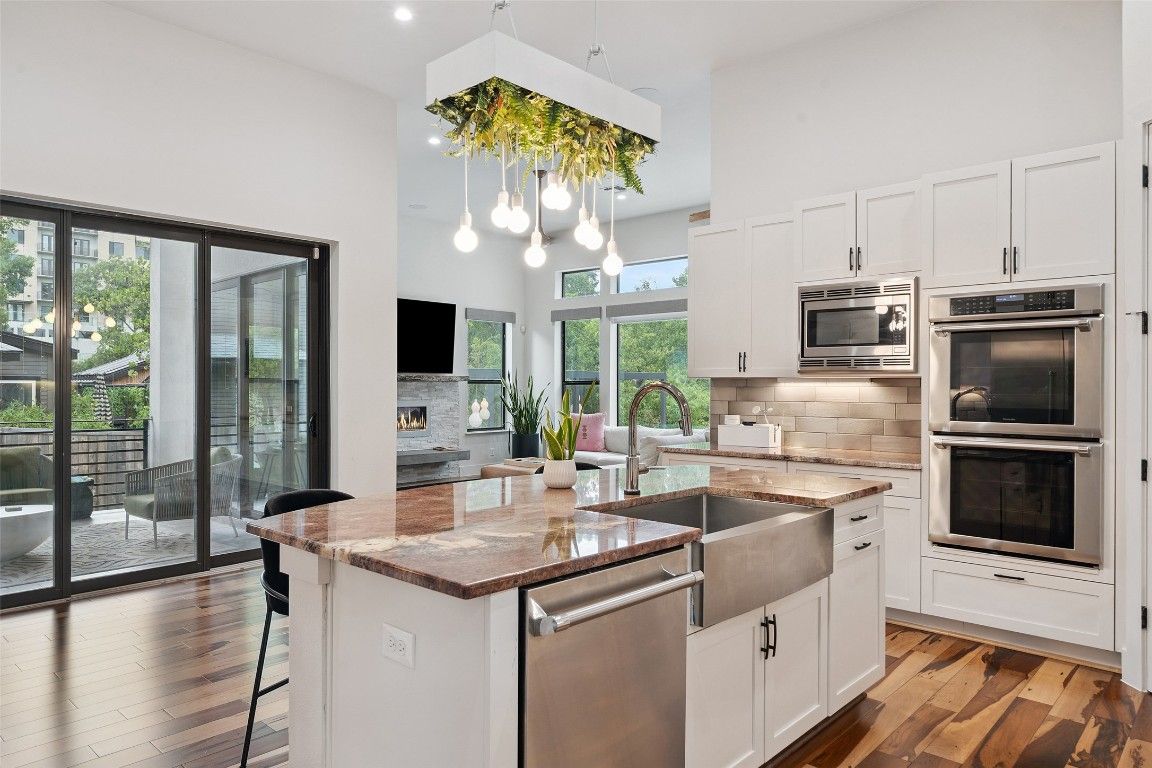 Fireplace, Interior, Kitchen, Pendant Lights, Recessed Lighting, Stainless Steel Appliances, Wood Texture Flooring