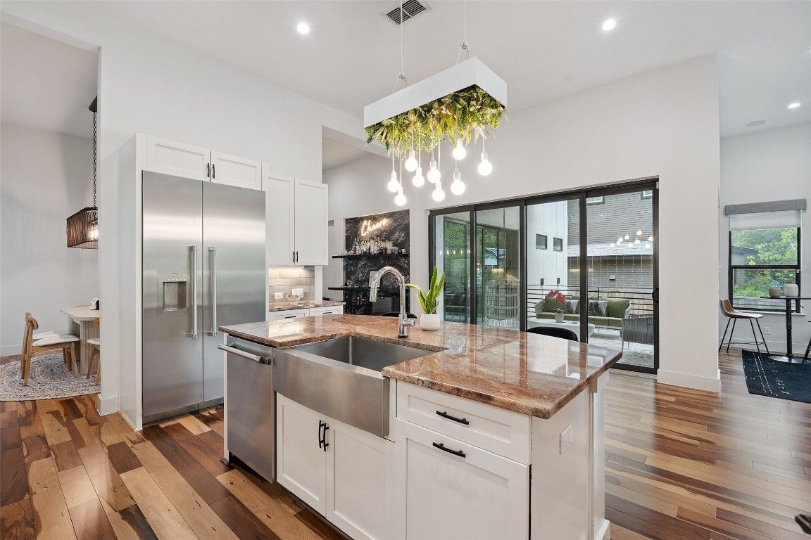 Dining room, Interior, Kitchen, Pendant Lights, Recessed Lighting, Stainless Steel Appliances, Wood Texture Flooring