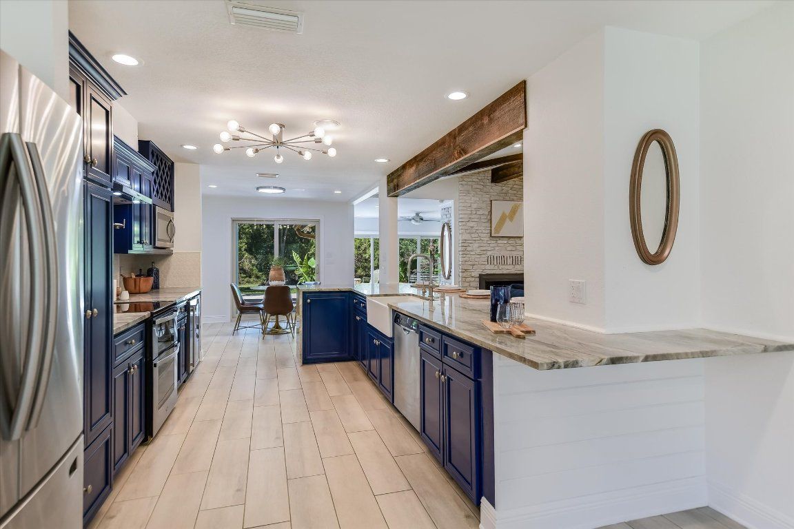Dining room, Interior, Kitchen, Pendant Lights, Recessed Lighting, Stainless Steel Appliances, Stone Walls, Wood Texture Flooring