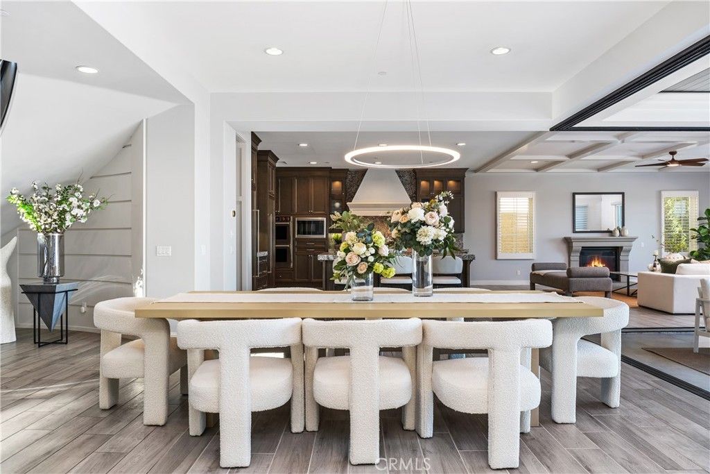 Dining room, Fireplace, Interior, Kitchen, Living room, Pendant Lights, Recessed Lighting, Stainless Steel Appliances, Wood Texture Flooring