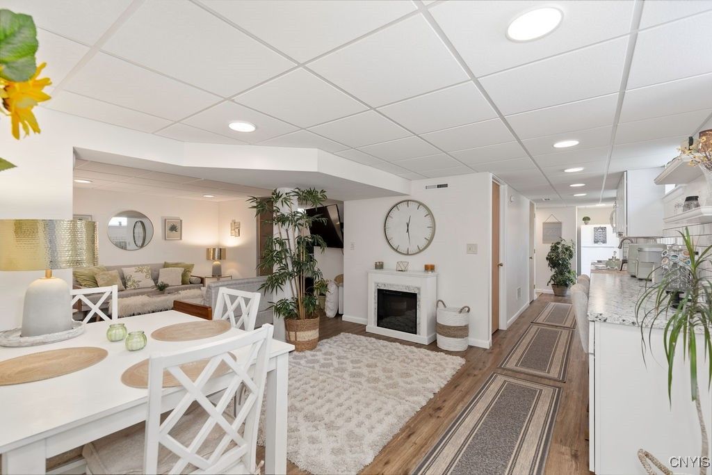 Dining room, Fireplace, Interior, Living room, Recessed Lighting, Wood Texture Flooring