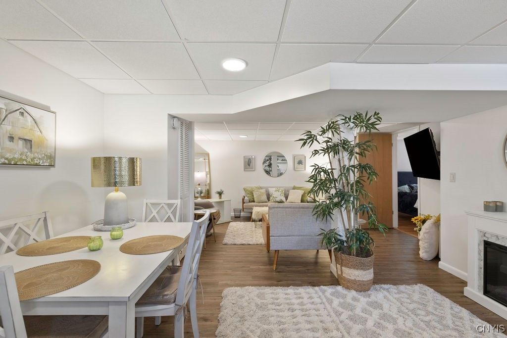 Dining room, Fireplace, Interior, Living room, Recessed Lighting, Wood Texture Flooring