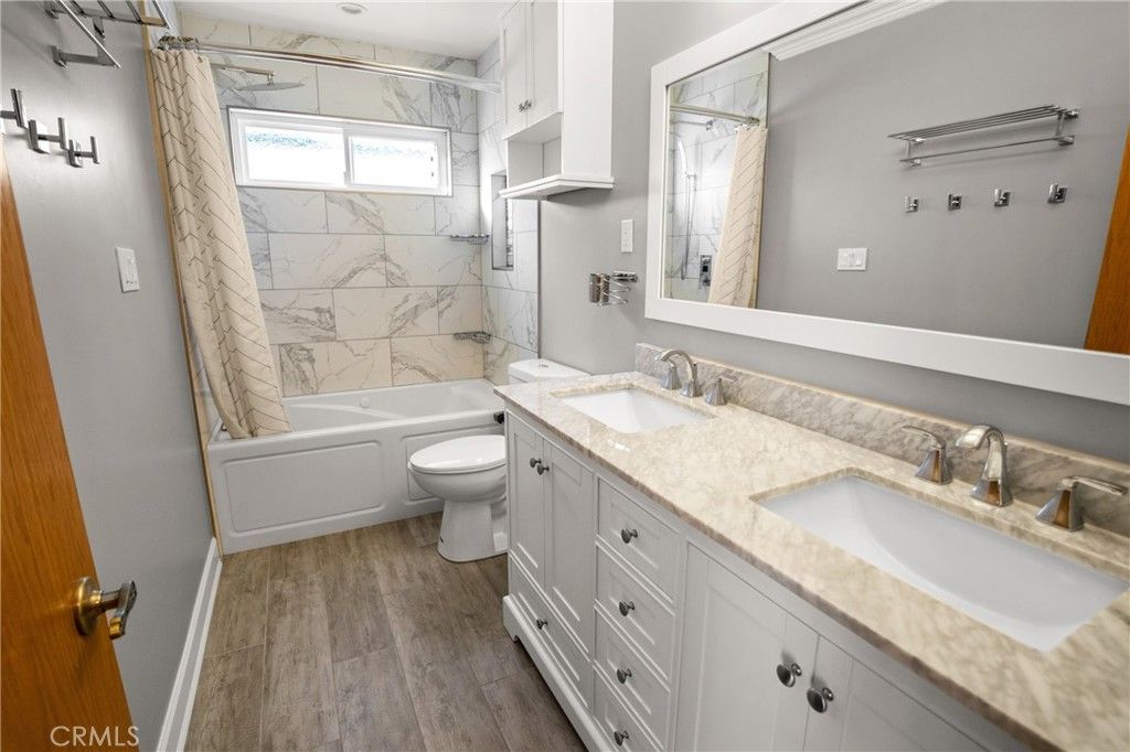 Bathroom, Dual Sink Vanities, Interior, Marble Walls, Wood Texture Flooring