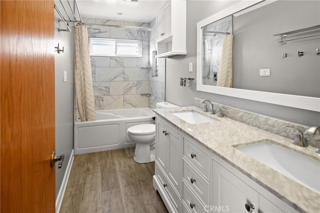 Bathroom, Dual Sink Vanities, Interior, Marble Walls, Wood Texture Flooring