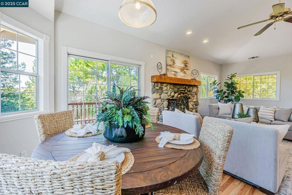 Dining room, Fireplace, Interior, Living room, Recessed Lighting, Wood Texture Flooring