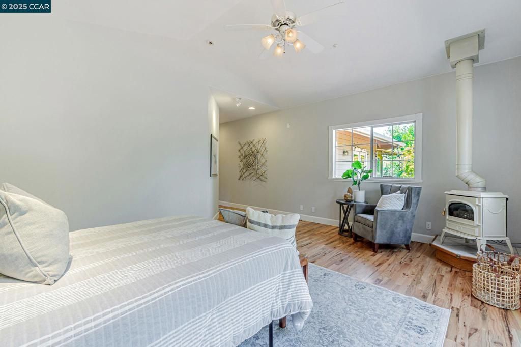 Bedroom, Fireplace, Interior, Recessed Lighting, Wood Texture Flooring