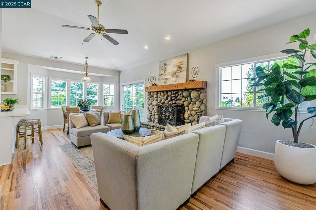Dining room, Fireplace, Interior, Living room, Pendant Lights, Recessed Lighting, Wood Texture Flooring