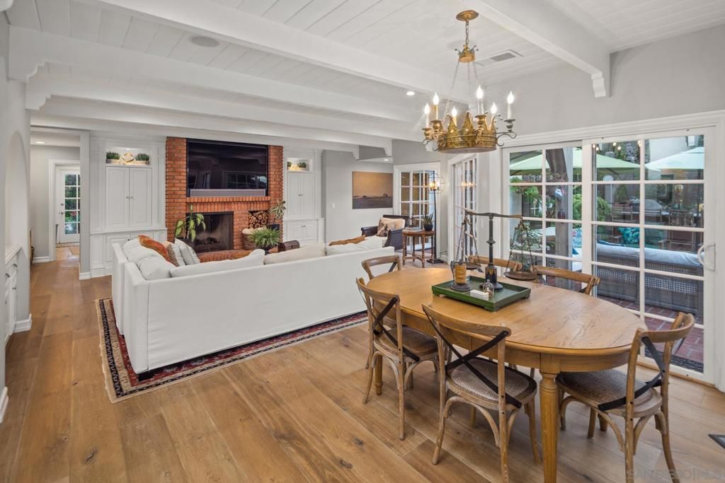 Chandelier, Dining room, Fireplace, Interior, Living room, Stone Walls, Wood Texture Flooring
