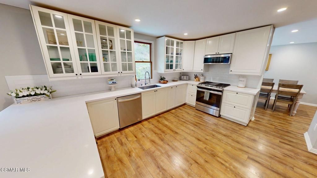 Dining room, Interior, Kitchen, Recessed Lighting, Stainless Steel Appliances, Wood Texture Flooring