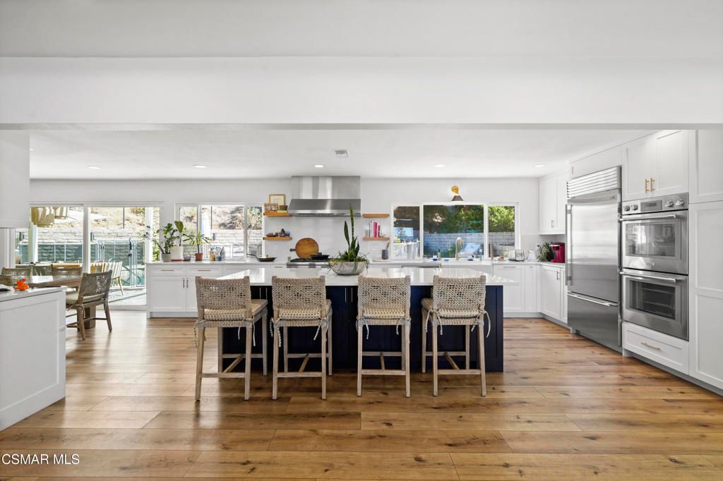 Dining room, Interior, Kitchen, Recessed Lighting, Stainless Steel Appliances, Wood Texture Flooring