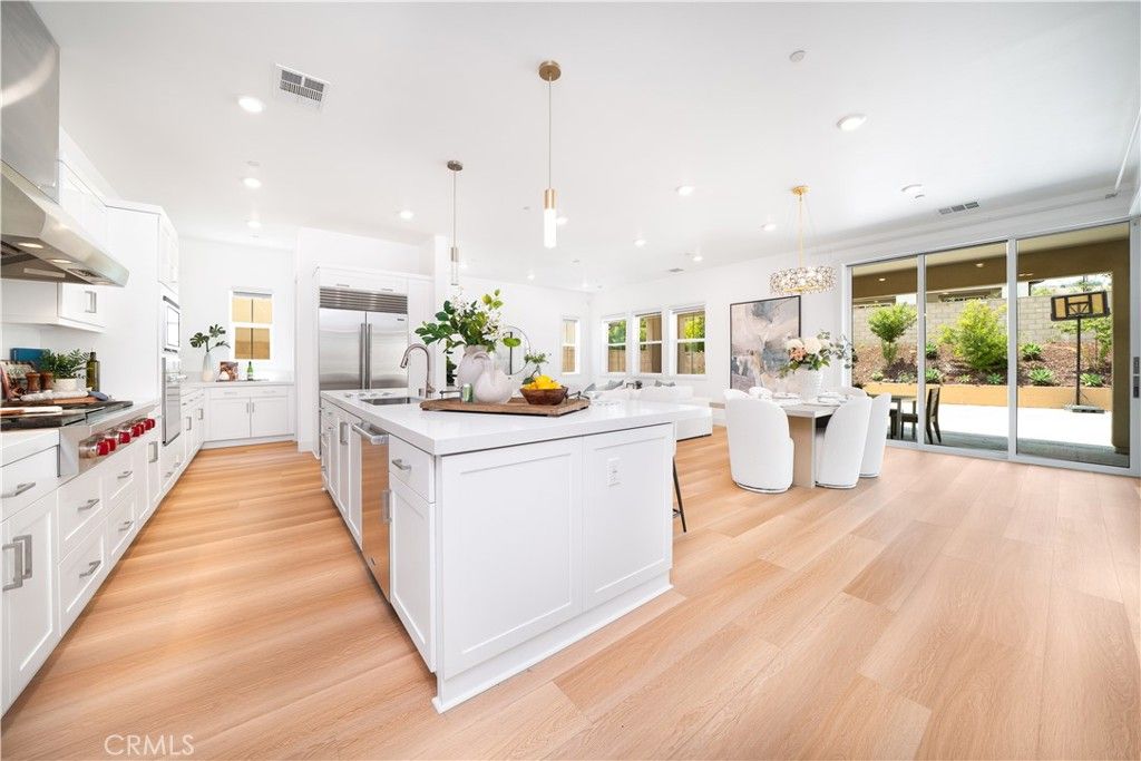 Dining room, Interior, Kitchen, Pendant Lights, Recessed Lighting, Stainless Steel Appliances, Wood Texture Flooring