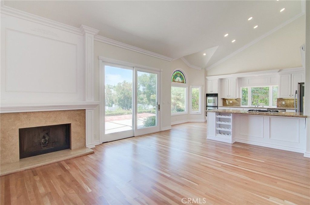 Empty room, Fireplace, Interior, Kitchen, Recessed Lighting, Wood Texture Flooring