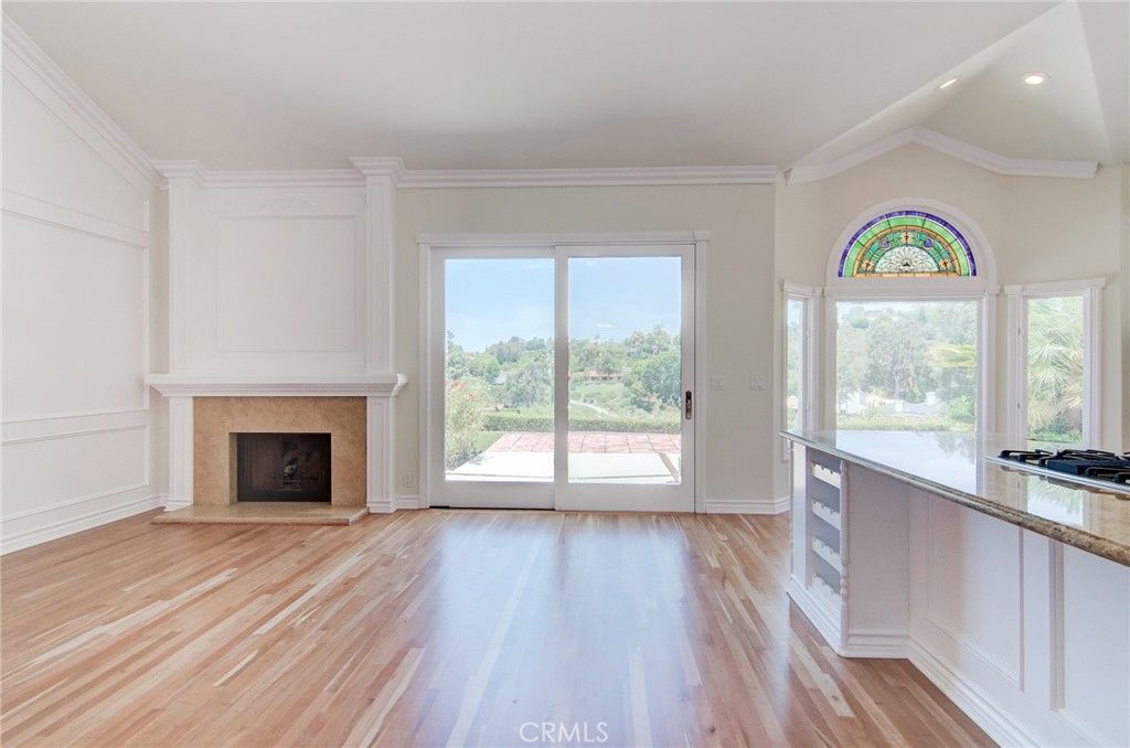 Empty room, Fireplace, Interior, Kitchen, Recessed Lighting, Wood Texture Flooring