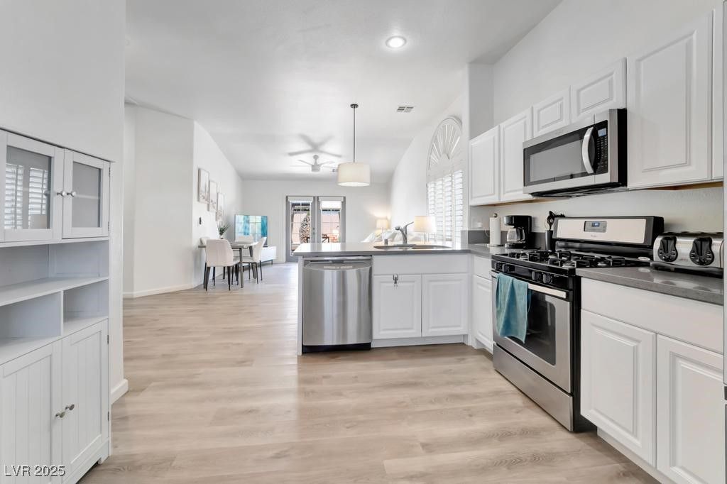 Dining room, Interior, Kitchen, Pendant Lights, Recessed Lighting, Stainless Steel Appliances, Wood Texture Flooring