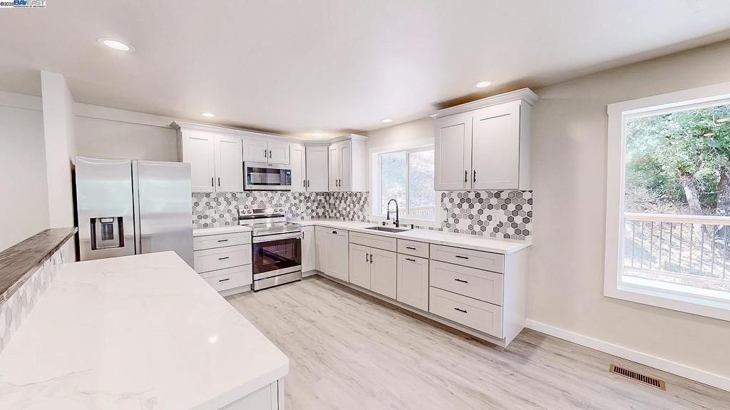 Interior, Kitchen, Recessed Lighting, Stainless Steel Appliances, Wood Texture Flooring