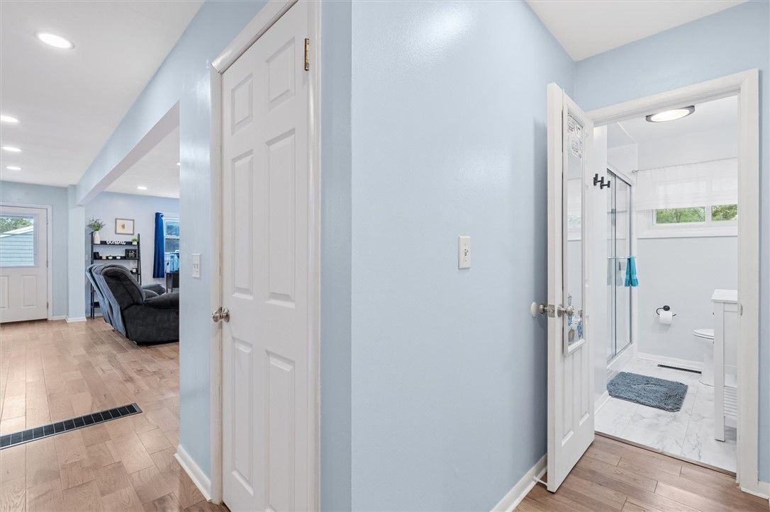 Bathroom, Interior, Marble, Recessed Lighting, Washer, Wood Texture Flooring