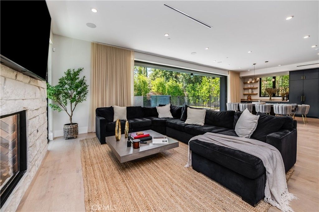 Dining room, Fireplace, Interior, Living room, Pendant Lights, Recessed Lighting, Wood Texture Flooring