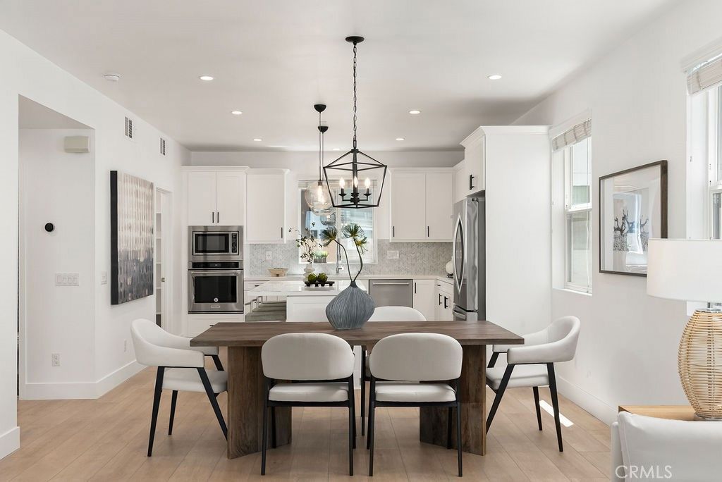 Dining room, Interior, Kitchen, Pendant Lights, Recessed Lighting, Stainless Steel Appliances, Wood Texture Flooring