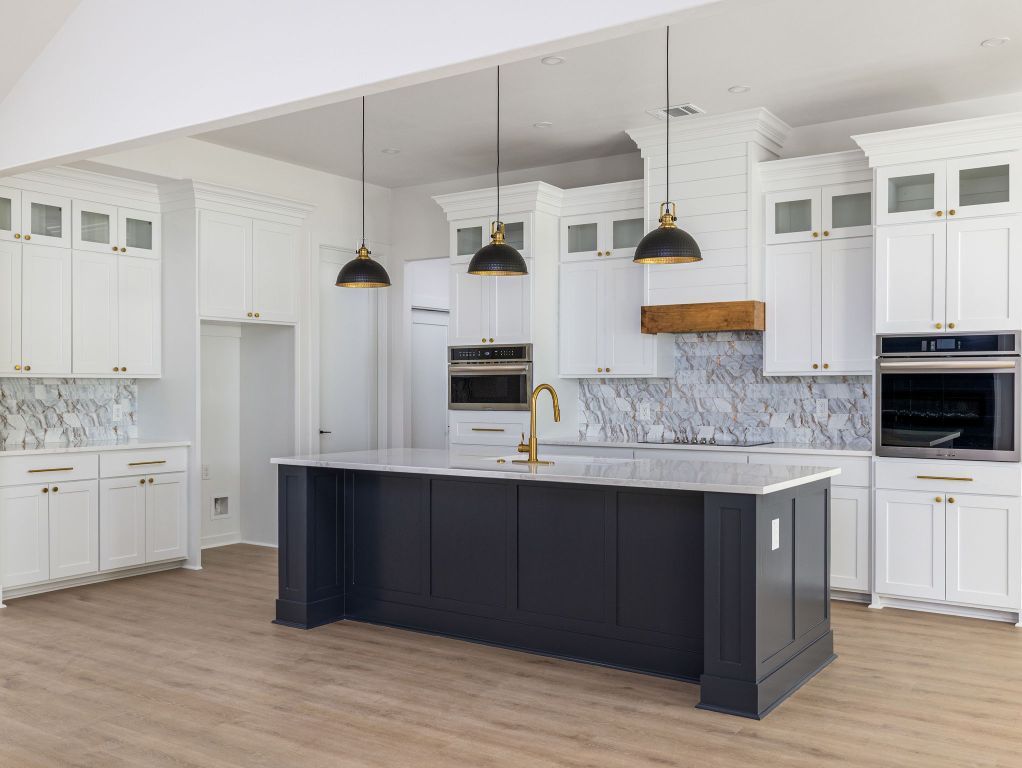 Interior, Kitchen, Marble Walls, Pendant Lights, Recessed Lighting, Stainless Steel Appliances, Wood Texture Flooring