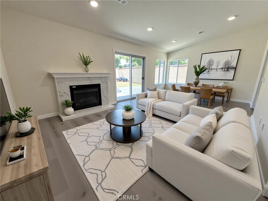 Dining room, Fireplace, Interior, Living room, Recessed Lighting, Wood Texture Flooring