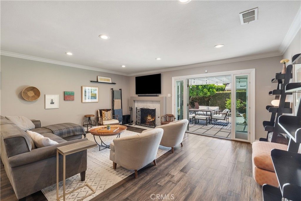 Fireplace, Fitness Equipment, Interior, Living room, Recessed Lighting, Wood Texture Flooring