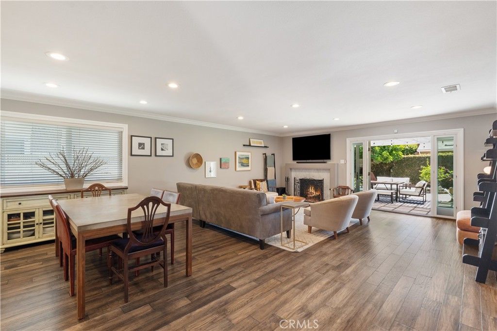 Dining room, Fireplace, Interior, Living room, Recessed Lighting, Wood Texture Flooring