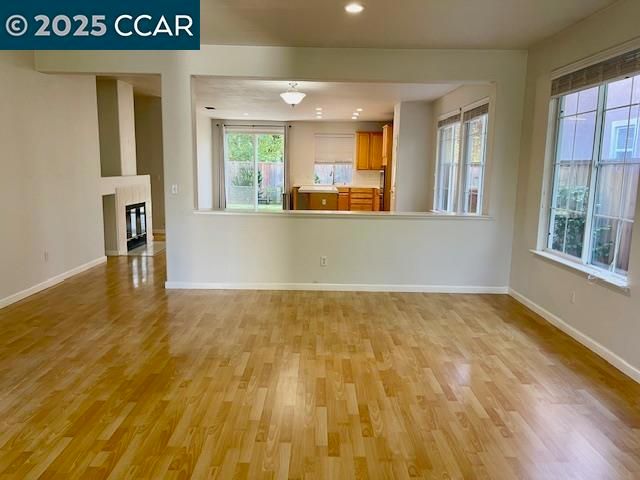 Empty room, Fireplace, Interior, Kitchen, Pendant Lights, Recessed Lighting, Wood Texture Flooring