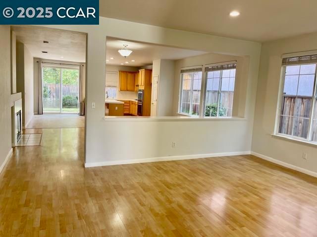 Empty room, Fireplace, Interior, Kitchen, Recessed Lighting, Wood Texture Flooring